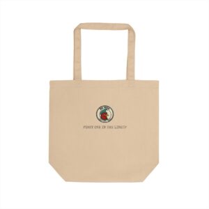 Da Moa 'First One in the Lineup' badge on a natural canvas eco tote bag
