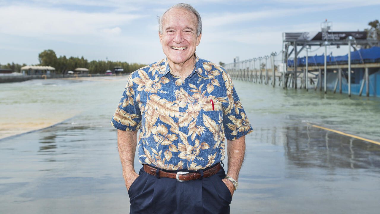 Fred Hemmings smiling in an aloha shirt at the WSL Surf Ranch wave pool in Lemoore, California